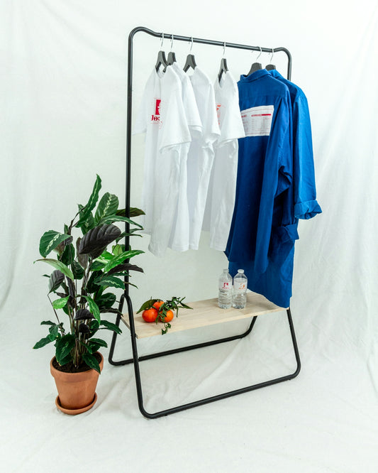 blue polo shirt on white clothes hanger