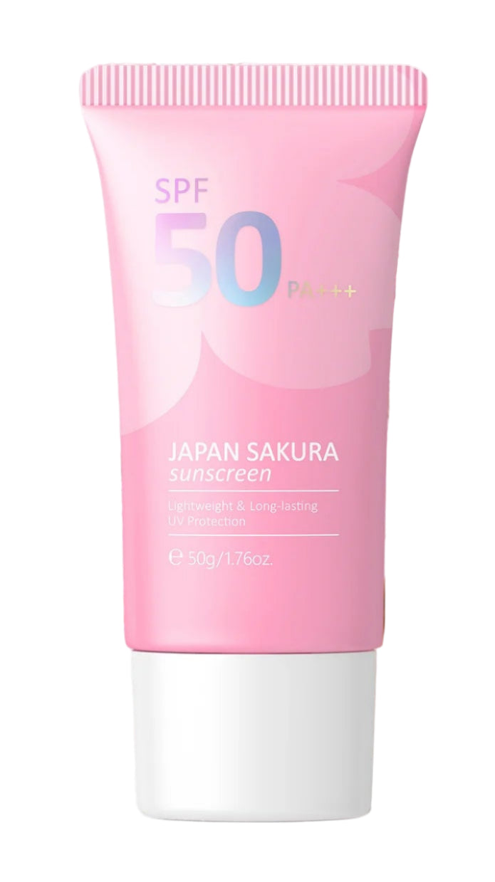 Woman applying sunscreen with a pink SPF 50 sunscreen tube in the foreground