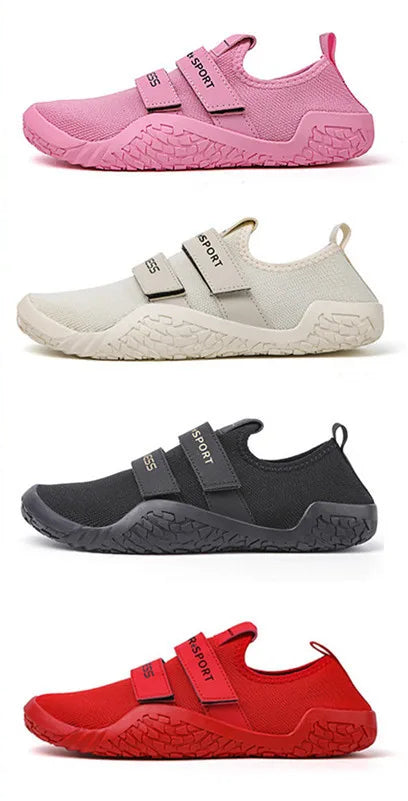 Two people in a gym setting with a display of pink, white, black, and red athletic shoes.