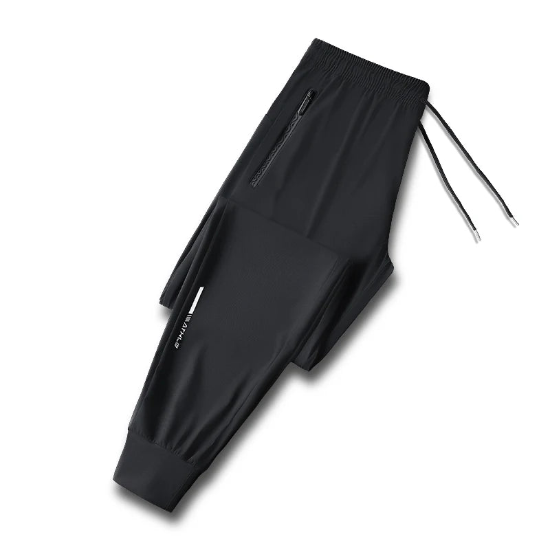 بنطلون رجالي من الحرير الجليدي بلون واحد - بنطلون صيفي مرن سريع الجفاف فضفاض للرياضة والعمل الكاجوال (M-8XL)