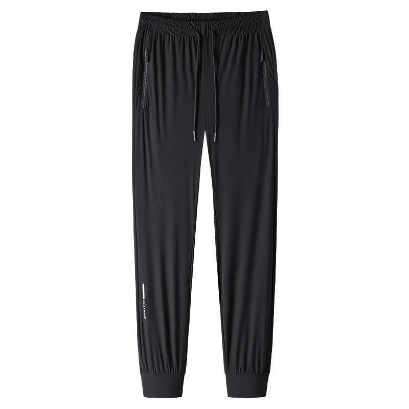 بنطلون رجالي من الحرير الجليدي بلون واحد - بنطلون صيفي مرن سريع الجفاف فضفاض للرياضة والعمل الكاجوال (M-8XL)